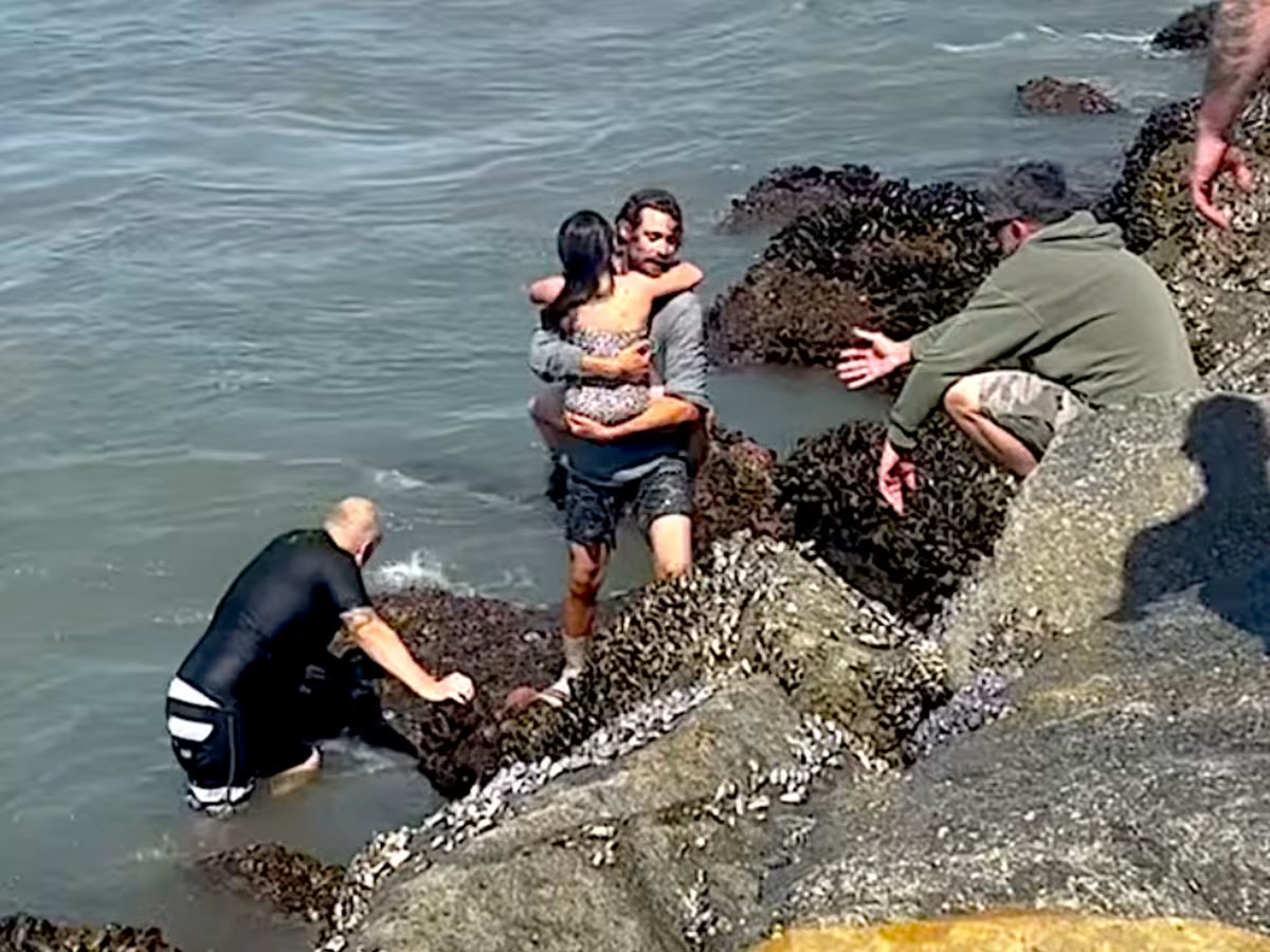 Luas Taub rescuing Chris and Coco Greene from rip current in Oceanside, CA